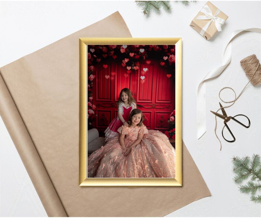 photo of two girls in a gold frame with parchment paper under it