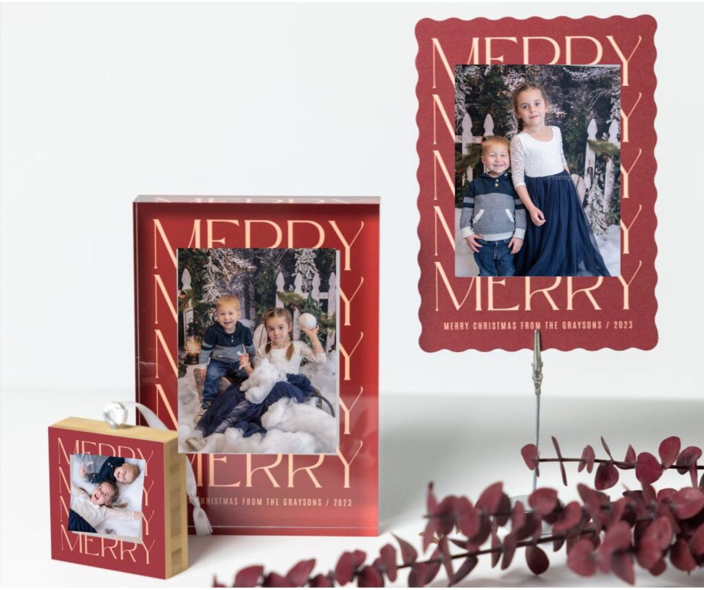 merry photo frames and ornaments with a photo of two children in them