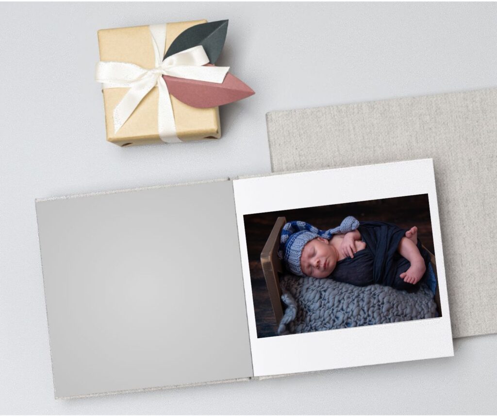 photo of a baby boy inside of an album with a linen cover